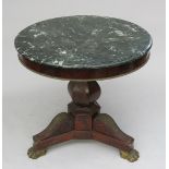 A French mahogany marble topped centre table, early 19th century, with a hexagonal bulbous stem,