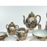 A Japanese kutani gilt decorated porcelain tea service.