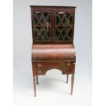 An Edwardian mahogany cylinder bureau bookcase,