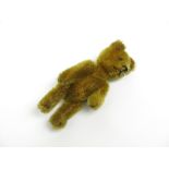 A rare Schuco plush teddy bear brooch, the pin fixed to the back, marked Schuco Patent,