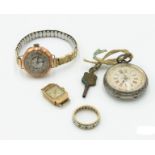 Two ladies gold cased wrist watches, a silver cased fob watch and a 9ct gold eternity ring.