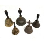 A collection of five assorted table bells, three with turned wooden handles,