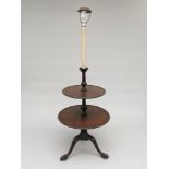 A George III mahogany two tier dumb waiter, converted to a standard lamp,