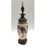 A Japanese satsuma vase converted to a table lamp, with gilt metal mounts and base, height 67cm.