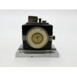 An Art Deco Ronson clock/lighter, height 9.5cm, width 10.5cm, depth 6.5cm.