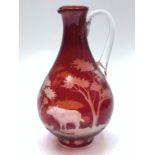 A ruby overlay jug, 20th century, engraved with a buffalo in an African landscape, height 27cm.