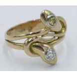 A high purity gold snake entwined ring, set with a white diamond and a yellow diamond.