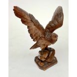 A fine 19th century lindenwood carving of an eagle, possibly Black Forest, height 37cm.