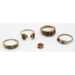 A Regency gold ring set with cameos and three other gold rings, each in some way is defective.