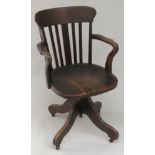 An oak swivel office chair, early 20th century, height 91.5cm.