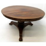 A William IV rosewood centre table, the circular top on an octagonal stem and triform base,
