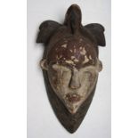 An African wooden Tsogo tribal mask, Gabon, height 36cm width 19cm.