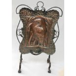 An Art Nouveau copper and wrought iron firescreen, height 81cm, width 53.5cm.