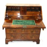 An early George ll walnut bureau,