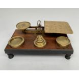 A pair of large Victorian walnut and brass parcel scales, the pan with etched postage rates,