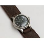 An Omega military wristwatch, the screw on back dated 1956,