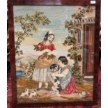 A needlepoint picture, early 20th century of a woman, child and dog, 88 x 72.5cm.