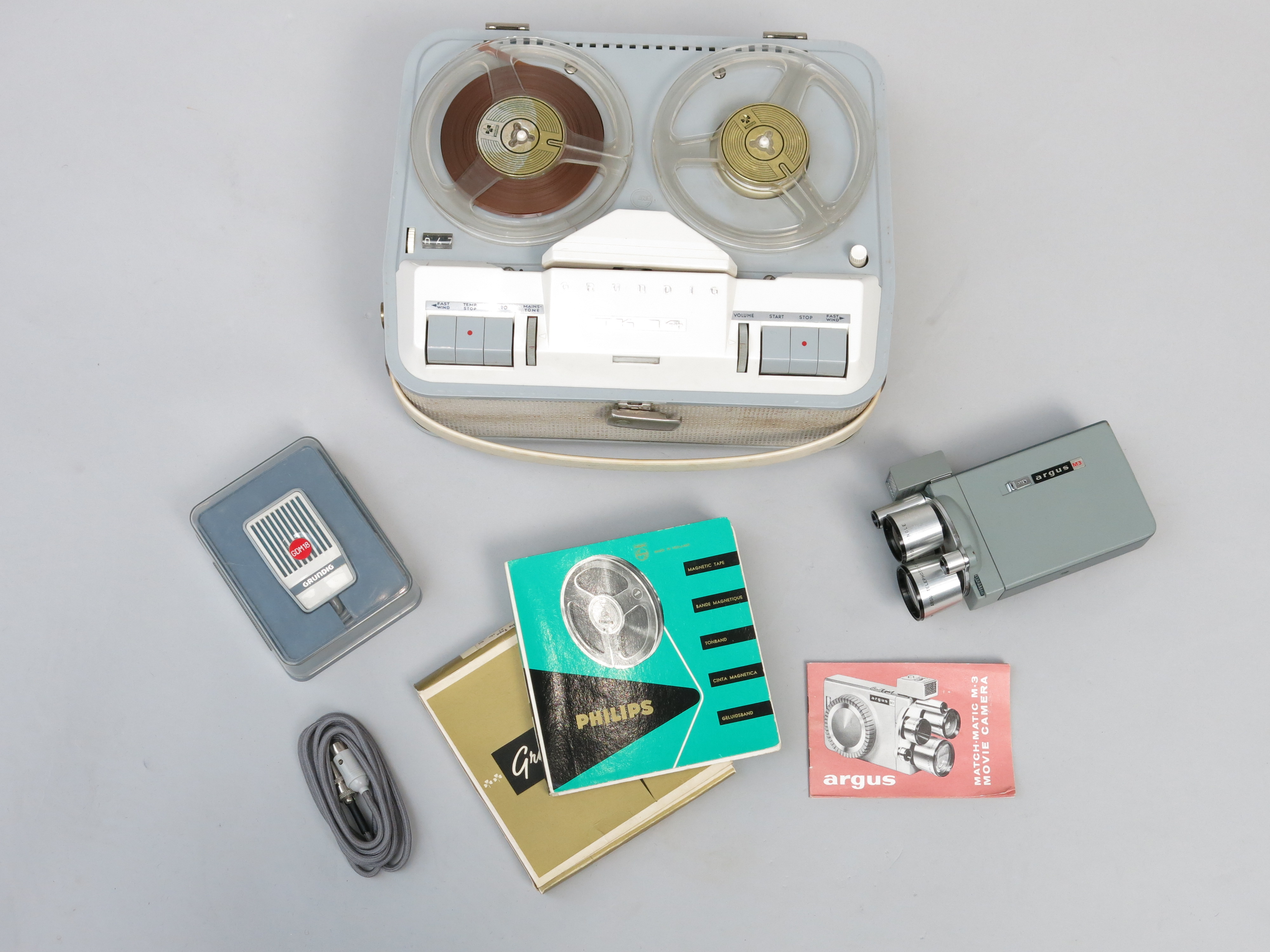 A grey Grundig TK14 reel to reel tape recorder, height 16cm, width 32cm, depth 27cm,
