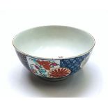 A First Period Worcester bowl, 18th century, decorated with panels of flowers and brocade designs,