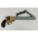 A Schermuly bronze and painted line throwing or Very pistol, stamped number 2560,