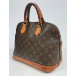 A Louis Vuitton monogram Alma handbag, cow hide leather handles and trim,