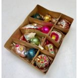 A collection of vintage coloured glass Christmas baubles.