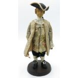 A figure of a fashionable Georgian gentleman, with carved wood head and hands, tricorn hat,