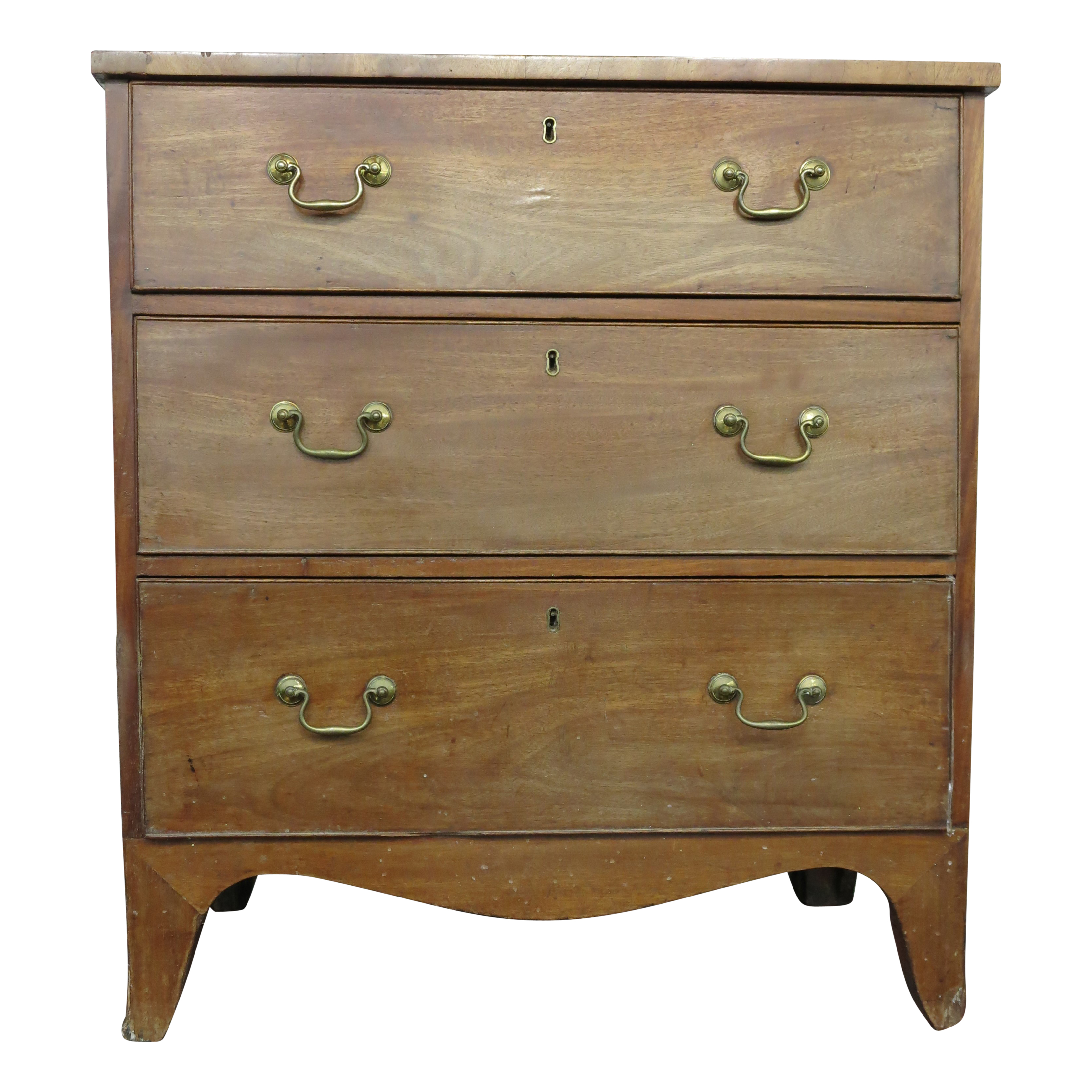 A mahogany chest of drawers, early 19th century, with three long drawers, with splayed bracket feet,