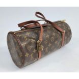 A Louis Vuitton monogram tubular handbag, cow hide leather handles, leather lined interior,