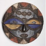 An African wooden Teke Tsaayi tribal mask, Gabon, height 30cm diameter 30cm.