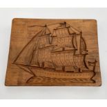 A wooden gingerbread mould carved with a three masted galleon, 42cm X 32cm.