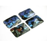 A group of four butterfly wing backed glass panels, each signed Seraphin.