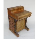 A Victorian figured walnut piano front harlequin Davenport,