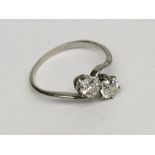 A white gold diamond crossover ring each stone of approximately 0.5ct spread.