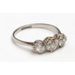 A good three stone diamond ring set in platinum, the central stone of approximately 0.65ct spread.