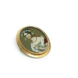 A 19th century gold mounted brooch with a heightened portrait of a lady, possibly Queen Victoria.