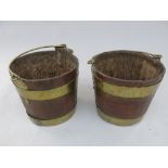 A pair of brass bound oak buckets, 19th century, coopered construction with brass swing handles,