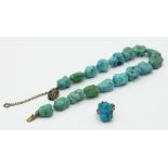 A Chinese matrix turquoise necklace with silver clasp, together with a matrix turquoise ring.