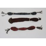 Three stocking purses early 19th century, each crocheted and mounted with steel beads and tassels,