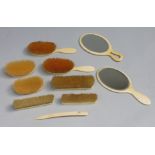 Two ivory hand mirrors, 19th Century, together with a collection of assorted Victorian brushes,