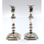 A pair of early 18th century style candlesticks, height 26cm.