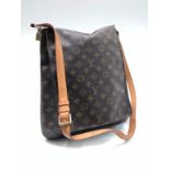 A Louis Vuitton monogram mussette bag, cow hide leather carrying strap, suede lined interior,