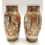 A pair of Japanese satsuma vases, 19th century, each panel enclosing figures on a balcony,