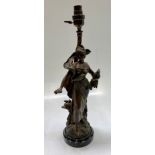 A French spelter figural lamp, after Moreau, modelled as a maiden with flowers,