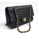 A Chanel black lambskin leather quilted shoulder bag, with turn-lock logo,