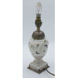 A good Berlin porcelain lamp base, silver mounted by A.