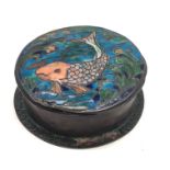 An Arts and Crafts copper and enamelled circular box and cover,