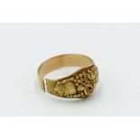 A Californian gold ring with applied vine leaves and beading, marked 18ct, 7g.