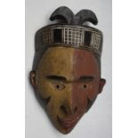 An African wooden Bakongo tribal polychrome mask, Congo, height 34cm width 20cm.