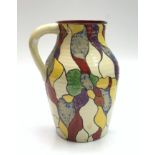 A large Clarice Cliff Bizarre Lotus shape jug, decorated with a leaf design, height 30cm.